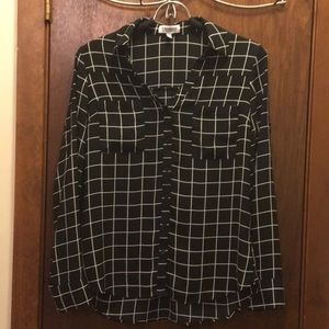 Black and white checkered blouse.